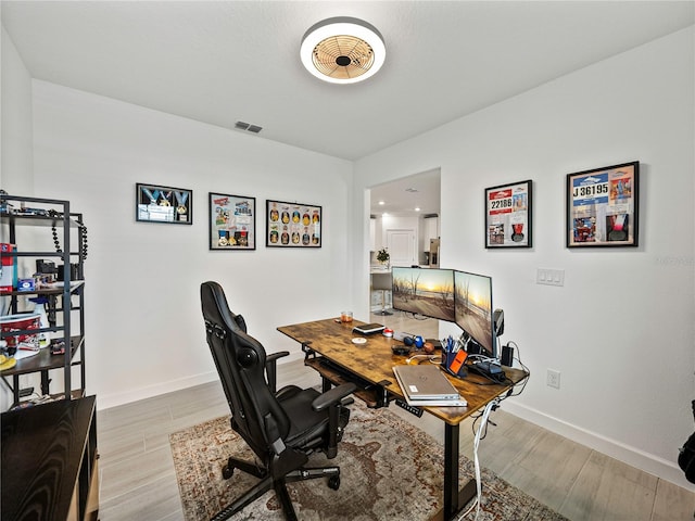 home office featuring light hardwood / wood-style flooring