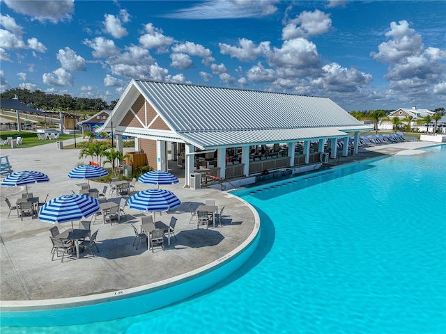 view of swimming pool with a patio area