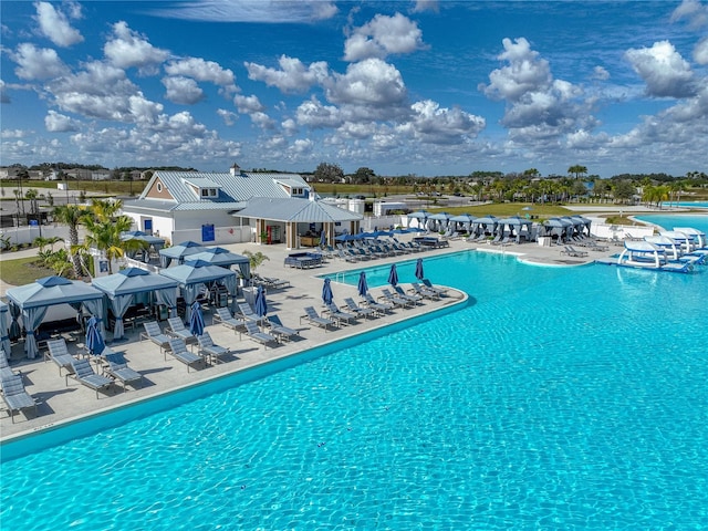 view of swimming pool with a gazebo and a patio area