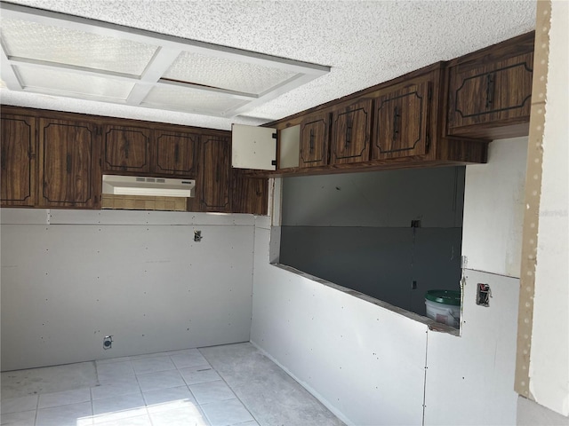 kitchen with dark brown cabinetry