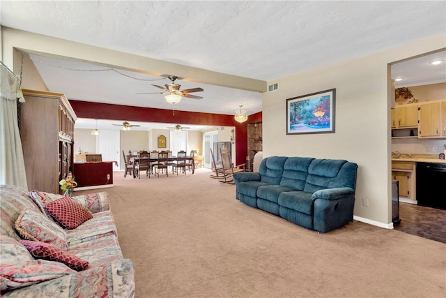 carpeted living room with sink and a textured ceiling