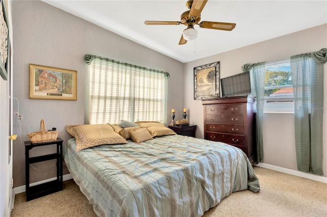 bedroom featuring ceiling fan and vaulted ceiling