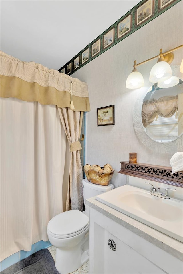 bathroom with tile patterned floors, vanity, and toilet