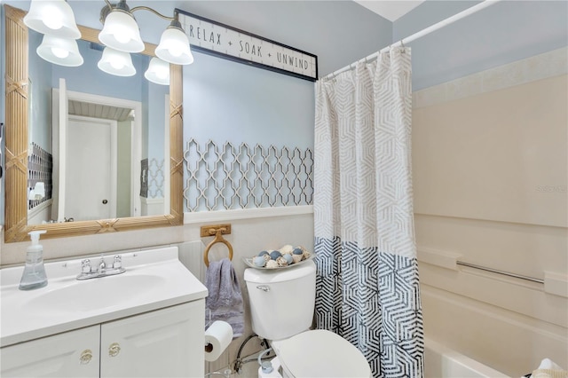 full bathroom with shower / bathtub combination with curtain, vanity, and toilet