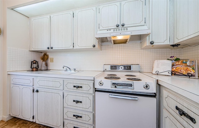 kitchen featuring backsplash, electric range oven, light parquet floors, sink, and white cabinets