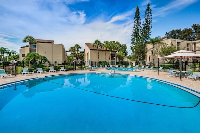 view of swimming pool featuring a patio area