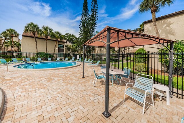 view of pool with a gazebo and a patio area