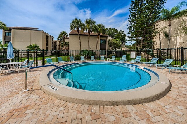 view of swimming pool with a patio