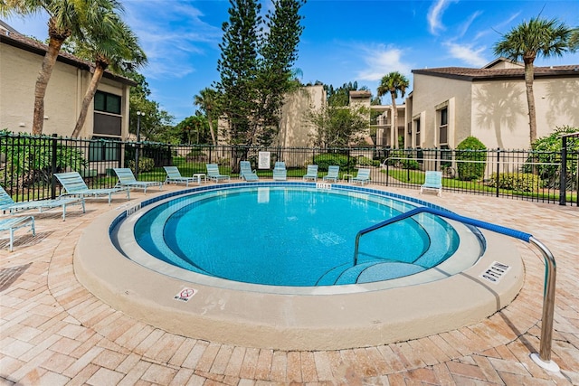 view of swimming pool featuring a patio