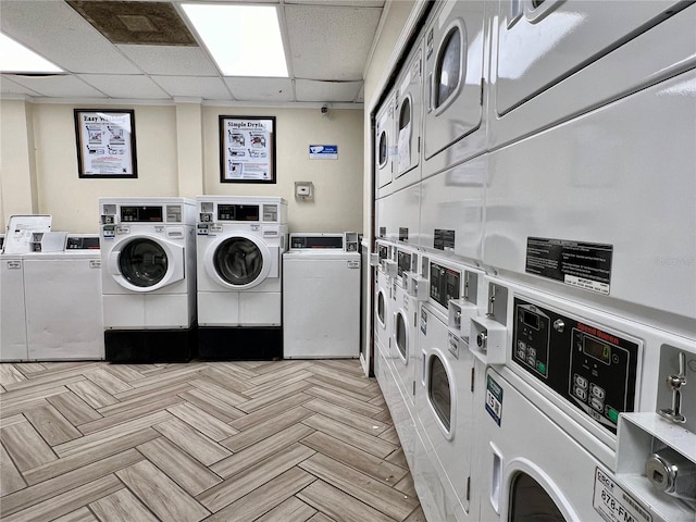 laundry area featuring stacked washer / dryer, separate washer and dryer, and light parquet flooring