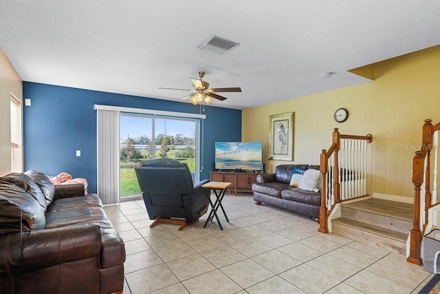 living room featuring ceiling fan and light tile patterned floors