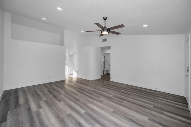 unfurnished living room featuring ceiling fan, dark hardwood / wood-style flooring, a textured ceiling, and high vaulted ceiling