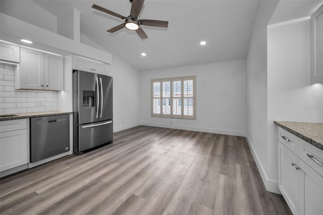 2292 Austrian Ln Unit 34, Clearwater, FL 33763 - kitchen featuring stainless steel appliances, lofted ceiling, a ceiling fan, decorative backsplash, and recessed lighting