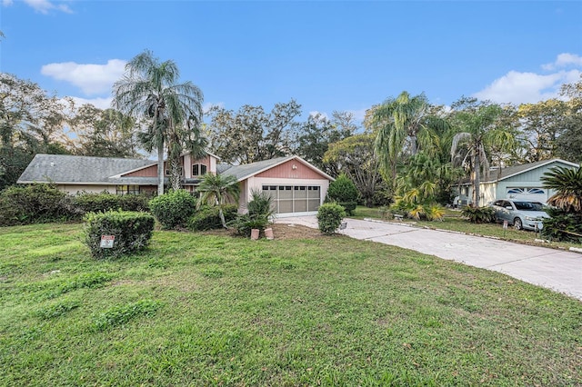 view of front of property with a garage and a front yard