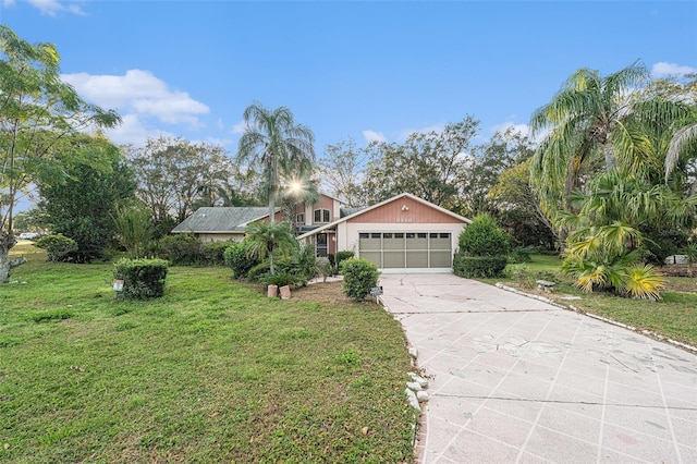 view of front facade with a front lawn and a garage