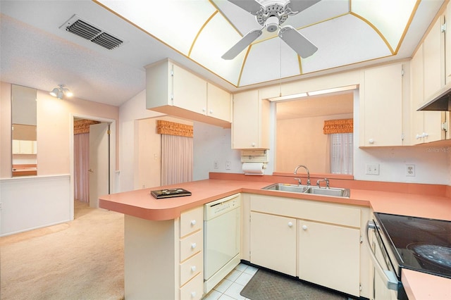 kitchen with kitchen peninsula, light carpet, white dishwasher, ceiling fan, and sink