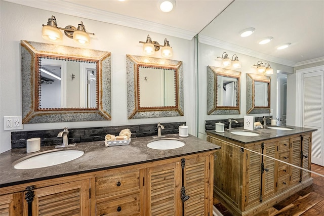 bathroom with hardwood / wood-style floors, vanity, and crown molding