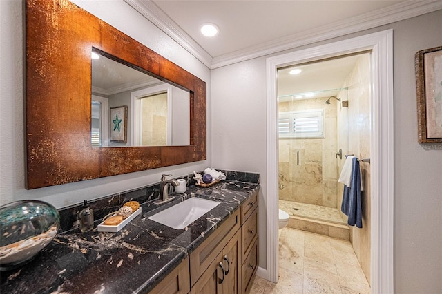 bathroom with walk in shower, toilet, vanity, and ornamental molding