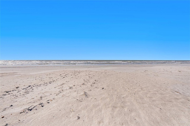 view of water feature with a beach view