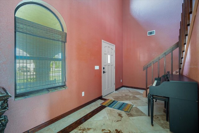 foyer entrance featuring a high ceiling