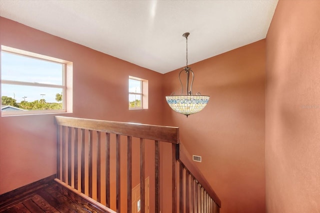 stairs with wood-type flooring