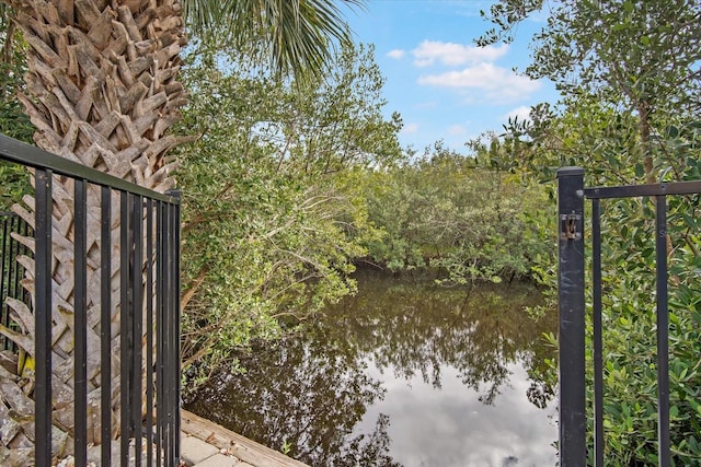 view of gate featuring a water view