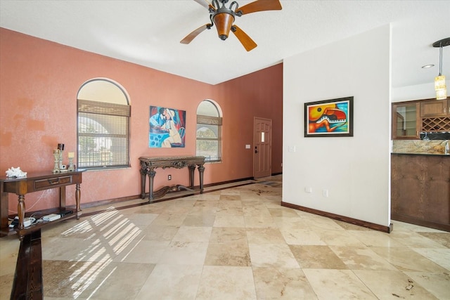 interior space featuring ceiling fan