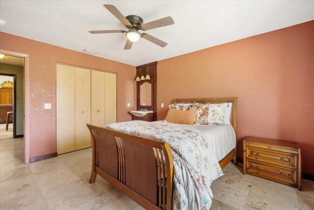 bedroom with a closet and ceiling fan