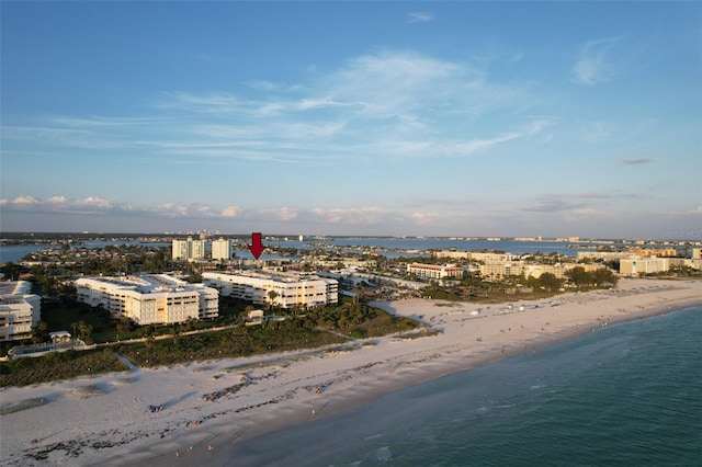 drone / aerial view with a water view and a view of the beach