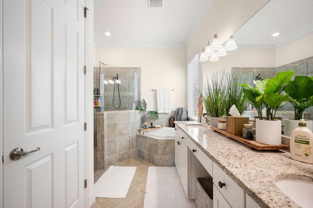 bathroom with plus walk in shower, vanity, crown molding, and tile patterned flooring