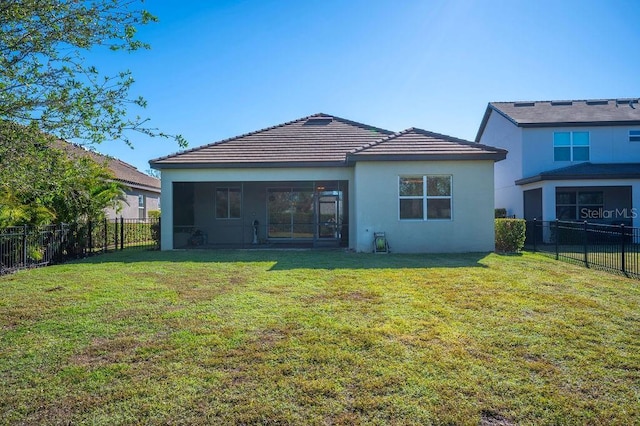 12241 Perennial Pl, Bradenton, FL 34211 - back of house featuring stucco siding, a sunroom, and a tile roof