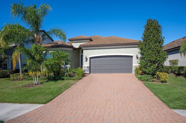 view of front facade featuring a garage and a front lawn