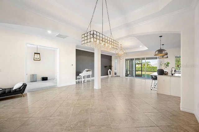 dining space with a tray ceiling, crown molding, and light tile patterned floors