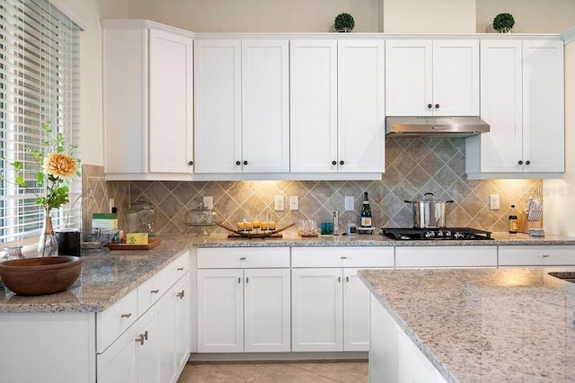 kitchen with black gas cooktop, white cabinetry, and plenty of natural light