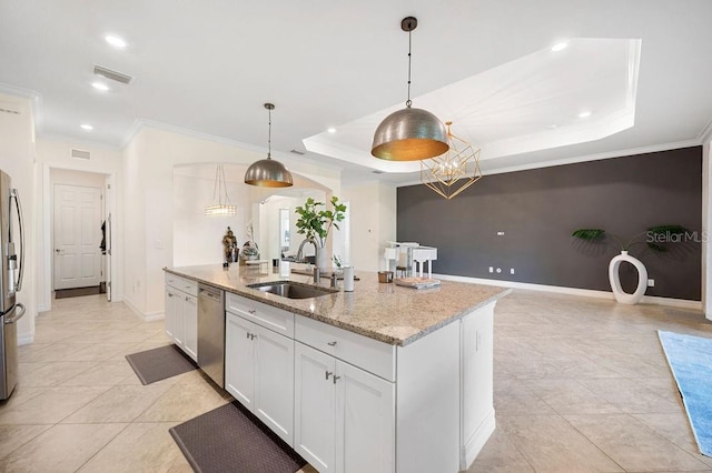 kitchen featuring light stone countertops, sink, a raised ceiling, decorative light fixtures, and white cabinets