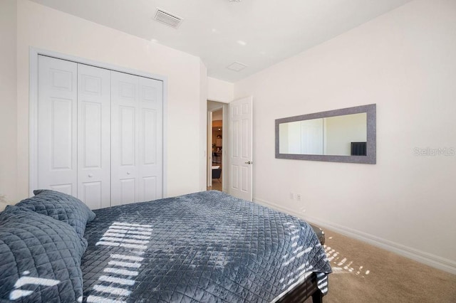 carpeted bedroom with a closet