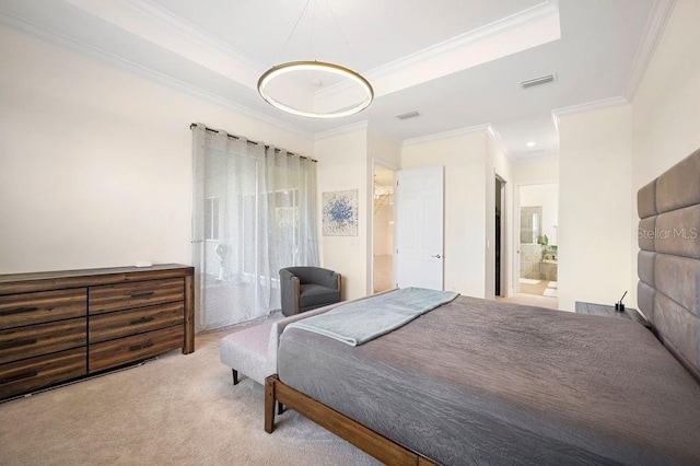 carpeted bedroom with a raised ceiling, ensuite bathroom, and crown molding