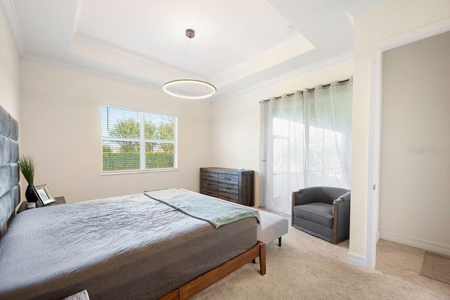 bedroom with light colored carpet, a raised ceiling, and crown molding