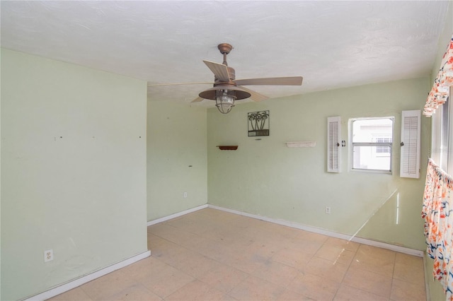 spare room featuring ceiling fan