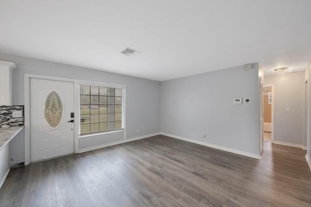 foyer with dark wood-type flooring