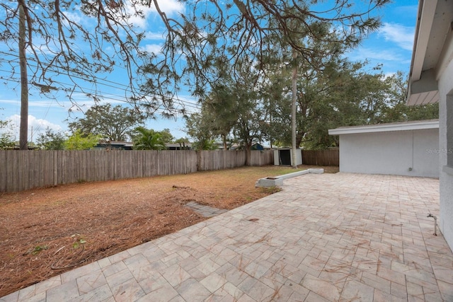 view of patio / terrace with a shed