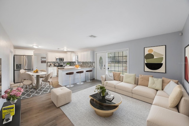 living room featuring light wood-type flooring