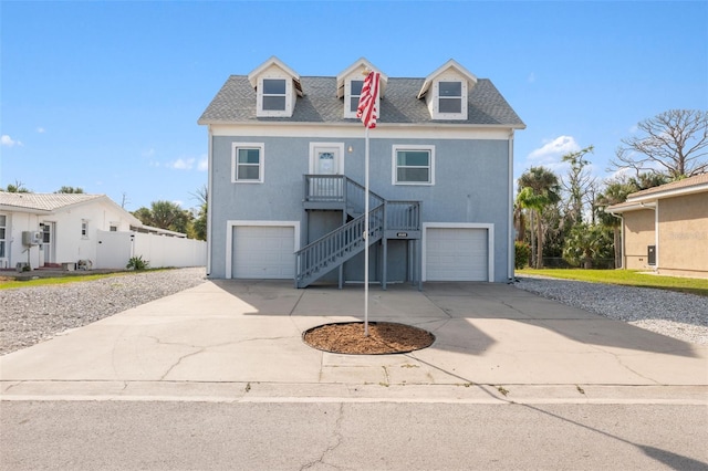 4148 Rudder Way, New Port Richey, FL 34652 - beach home featuring stairway, driveway, an attached garage, a shingled roof, and stucco siding