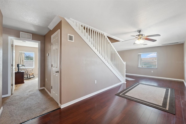 4148 Rudder Way, New Port Richey, FL 34652 - foyer entrance with stairway, a ceiling fan, baseboards, and wood finished floors