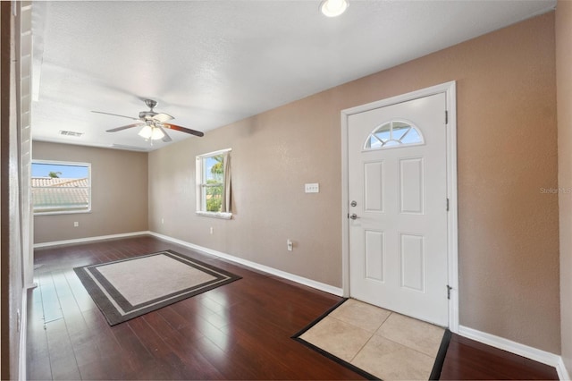4148 Rudder Way, New Port Richey, FL 34652 - foyer with healthy amount of natural light, a ceiling fan, and wood finished floors