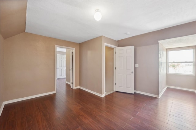 4148 Rudder Way, New Port Richey, FL 34652 - empty room with wood finished floors, vaulted ceiling, and a smoke detector