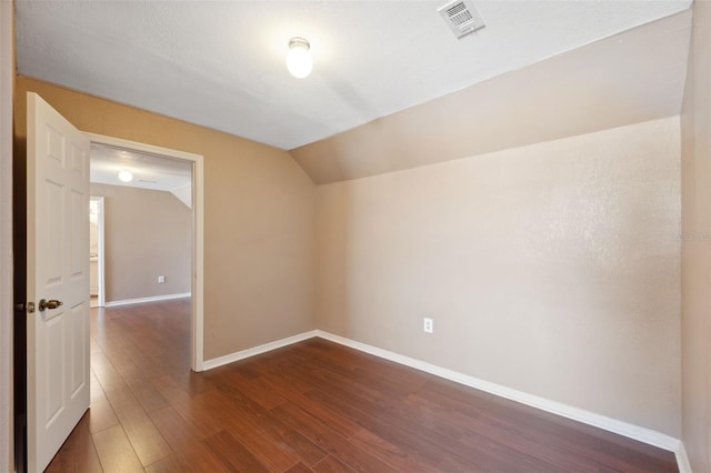 4148 Rudder Way, New Port Richey, FL 34652 - spare room featuring vaulted ceiling and dark wood-type flooring