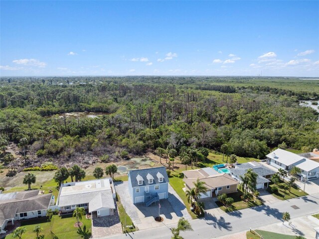 4148 Rudder Way, New Port Richey, FL 34652 - aerial perspective of suburban area with a heavily wooded area