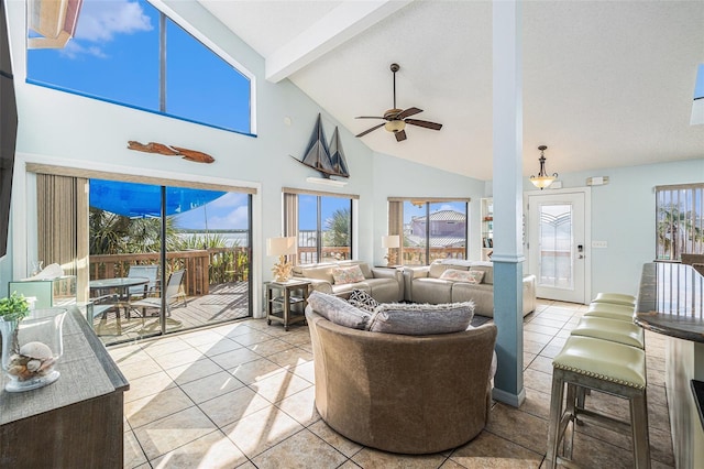 living room featuring beam ceiling, high vaulted ceiling, ceiling fan, and light tile patterned flooring