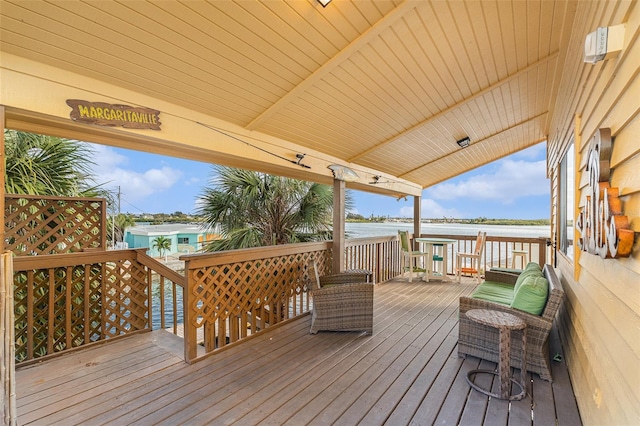 wooden deck featuring a water view